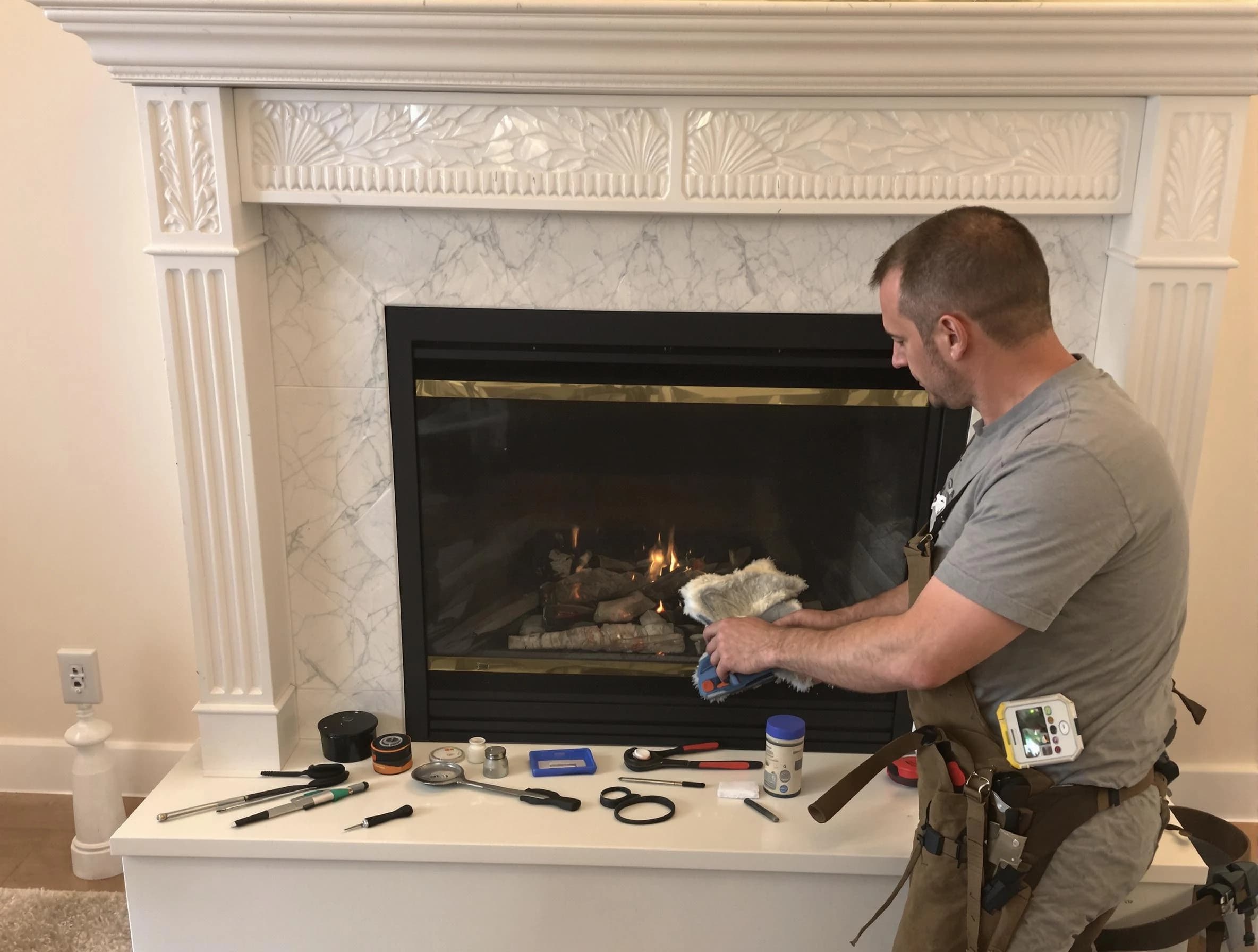 North Ogden Chimney Sweep performing fireplace maintenance in North Ogden, UT